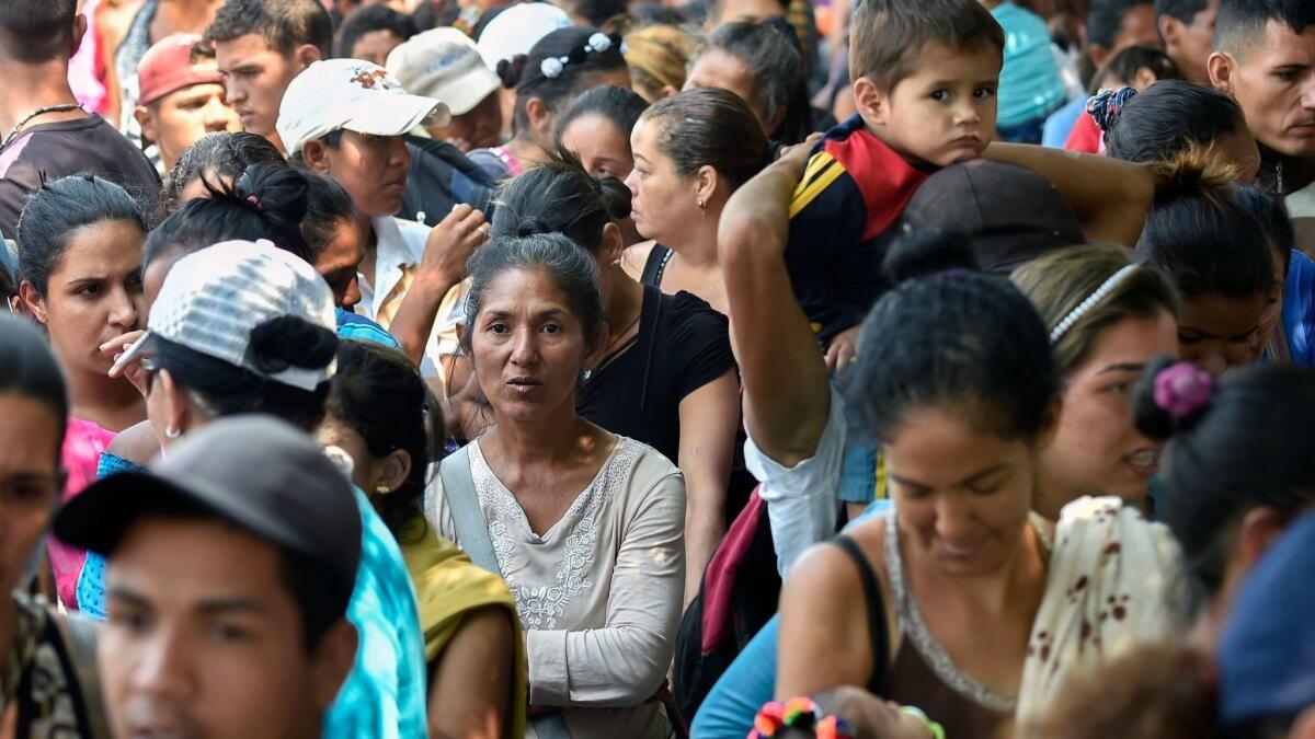 Venezuelan migrants gather outside La Divina Pastora shelter in Villa del Rosario, Colombia, in the border with Venezuela, on Feb. 13, 2019.