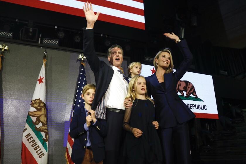 Gavin Newsom with wife Jennifer Siebel Newsom and family celebrating his win as Governor of California at Exchange LA in downtown Los Angeles.