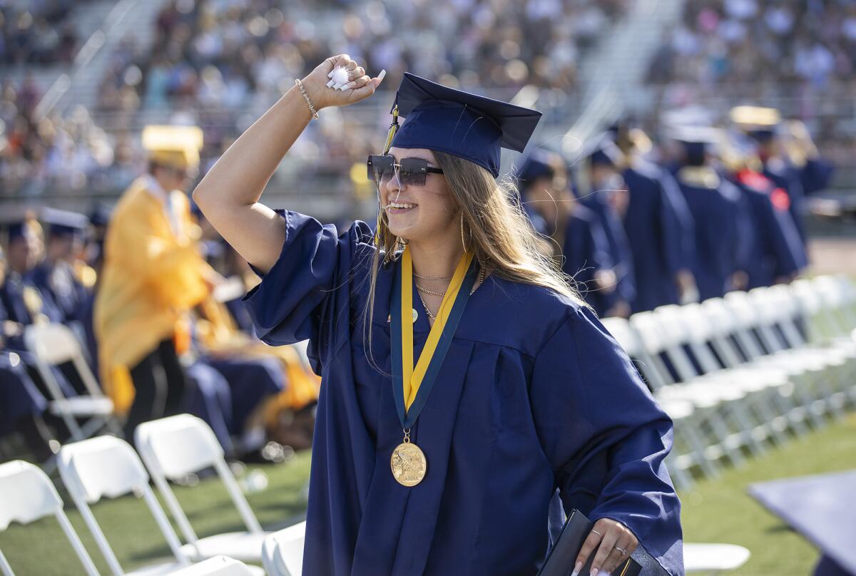 Haley Johnson pumps her fist in celebration during the Marina High School commencement ceremony on Thursday.
