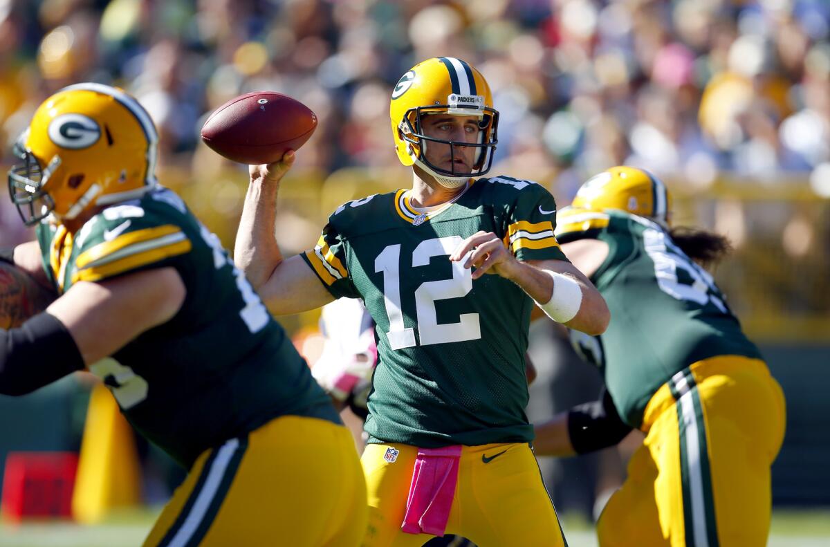 Green Bay Packers quarterback Aaron Rodgers looks to throw against the St. Louis Rams during a game on Oct. 11.