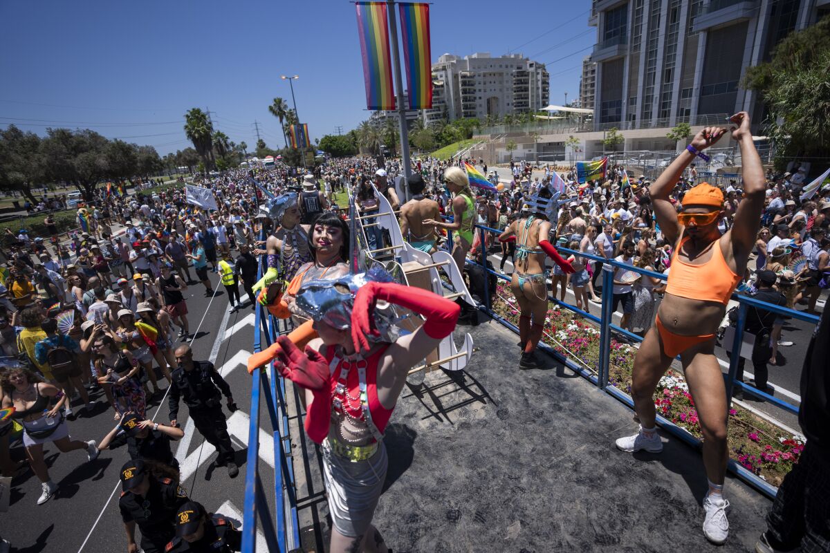 People participate in the annual Pride Parade, in Tel Aviv, Israel, Friday, June 10, 2022. (AP Photo/Oded Balilty)