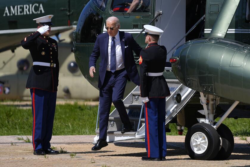 U.S. President Joe Biden alights from Marine One after arriving at the Normandy American Cemetery, France, before heading to Pointe du Hoc to deliver a speech on democracy and freedom, Friday, June 7, 2024. (AP Photo/Evan Vucci)