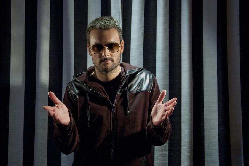 Country singer Eric Church's new album, "The Outsiders," is top of the U.S. pop charts.