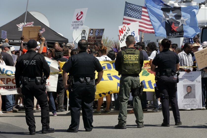 On the Fourth of July in 2014, protestors on both side of the migration issue rallied in front of the Murrieta Border Patrol headquarters in case new busloads of migrant children arrived again. About 100 people stood behind a tape away from the entrance to the station, most of them supporters of caring for the migrants, while about a block away, some 50 protestors who want the children sent home occupied a different intersection in case the buses came that way.