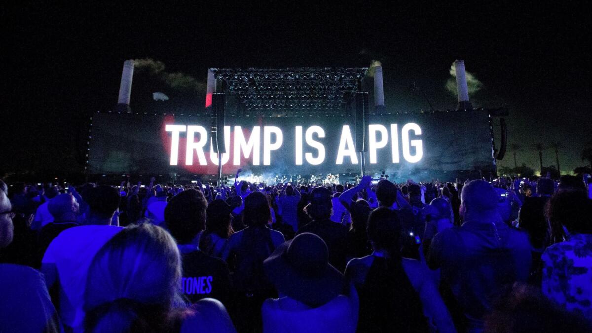 Roger Waters sends a message about then-Presidential candidate Donald Trump as he performs at Desert Trip at the Empire Polo Club grounds in Indio, Calif., on Oct. 9, 2016.