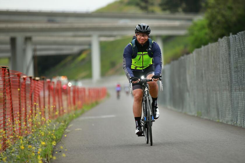Yi Chang rides south on the Rose Canyon Bike Path during the 29th Annual SANDAG Bike to Work Day in San Diego on May 16, 2019. Registered Bike to Work Day participants were greeted by volunteers at 100 pit stops across the county, where they received a free t-shirt, refreshments, and snacks. Chang was riding from the UTC area to Chula Vista.