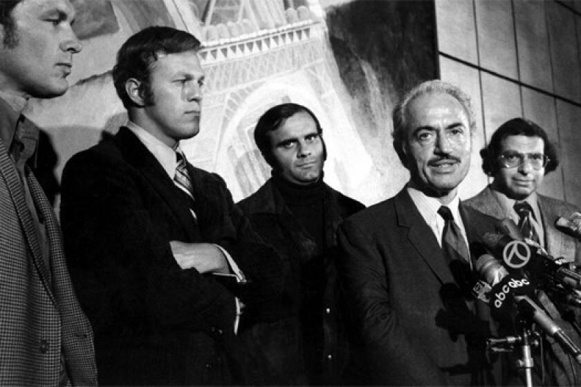 Marvin Miller, second from right, executive director of the Major League Baseball Players Assn., announces an end to the players' strike at a news conference on April 13, 1972. With Miller are players, from left, Gary Peers of the Boston Red Sox, Wes Parker of the Dodgers, and Joe Torre of the St. Louis Cardinals. At right is Dick Moss, assistant counsel for the association.