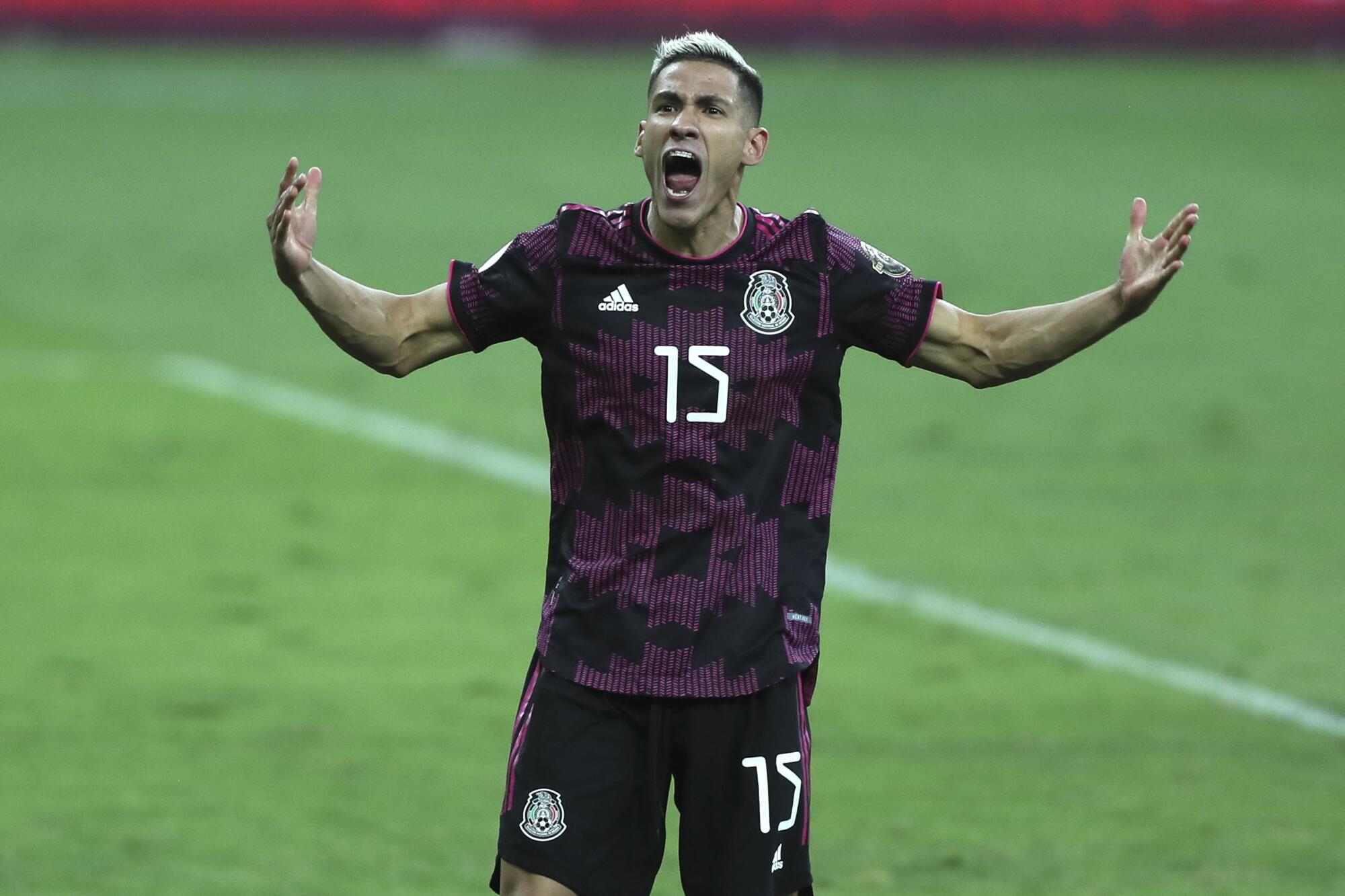 Mexico's Uriel Antuna celebrates after scoring against Honduras.