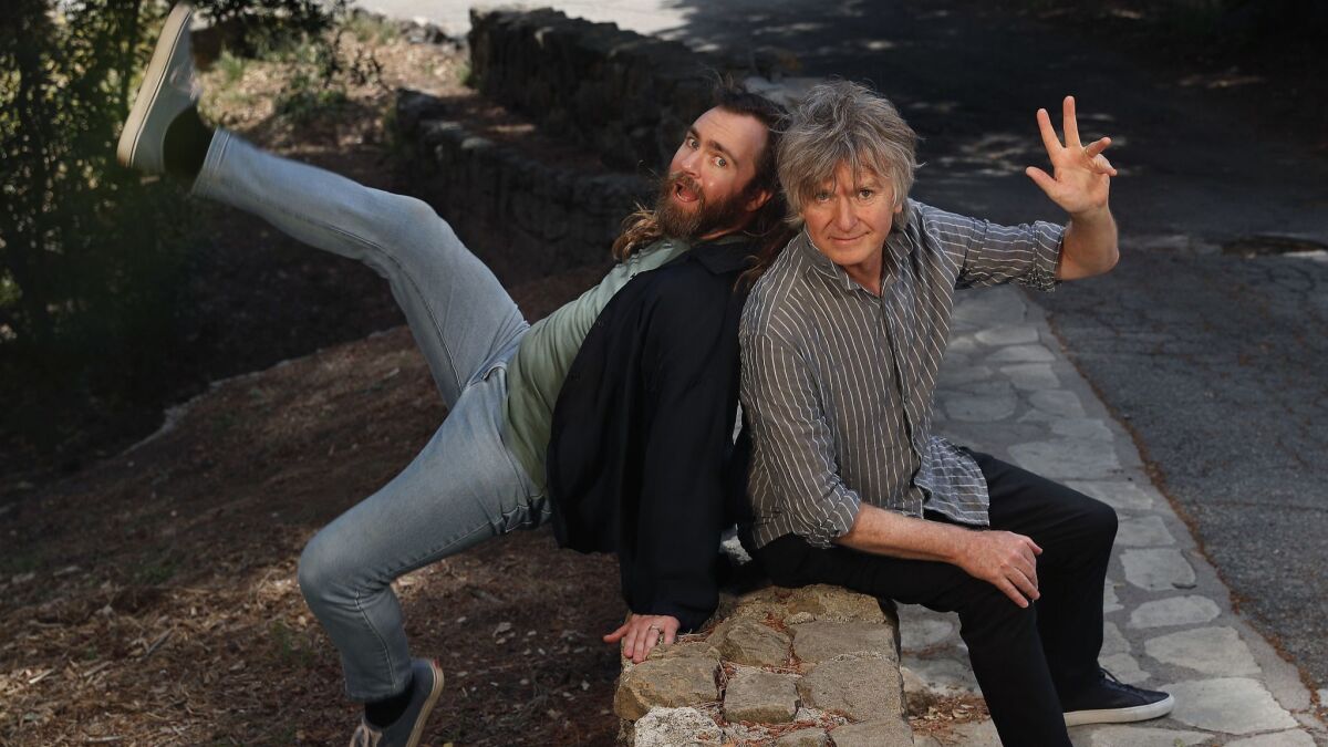 Musician Liam Finn, left, clowns with his father, Neil Finn, during a photo shoot in Griffith Park, echoing the playful spirit they often display onstage together and separately.