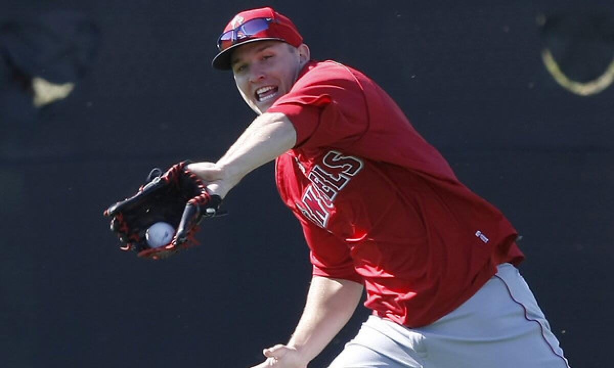 Angels center fielder Mike Trout makes a catch during a spring-training practice session on Feb. 20. Trout hit a two-run home run in Saturday's Cactus League win over the Milwaukee Brewers.