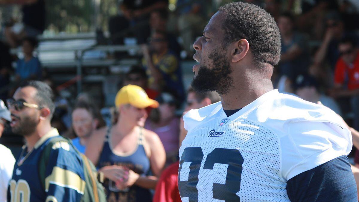 Rams defensive tackle Ndamukong Suh watches practice at the Rams training camp at UC-Irvine on Aug. 13.