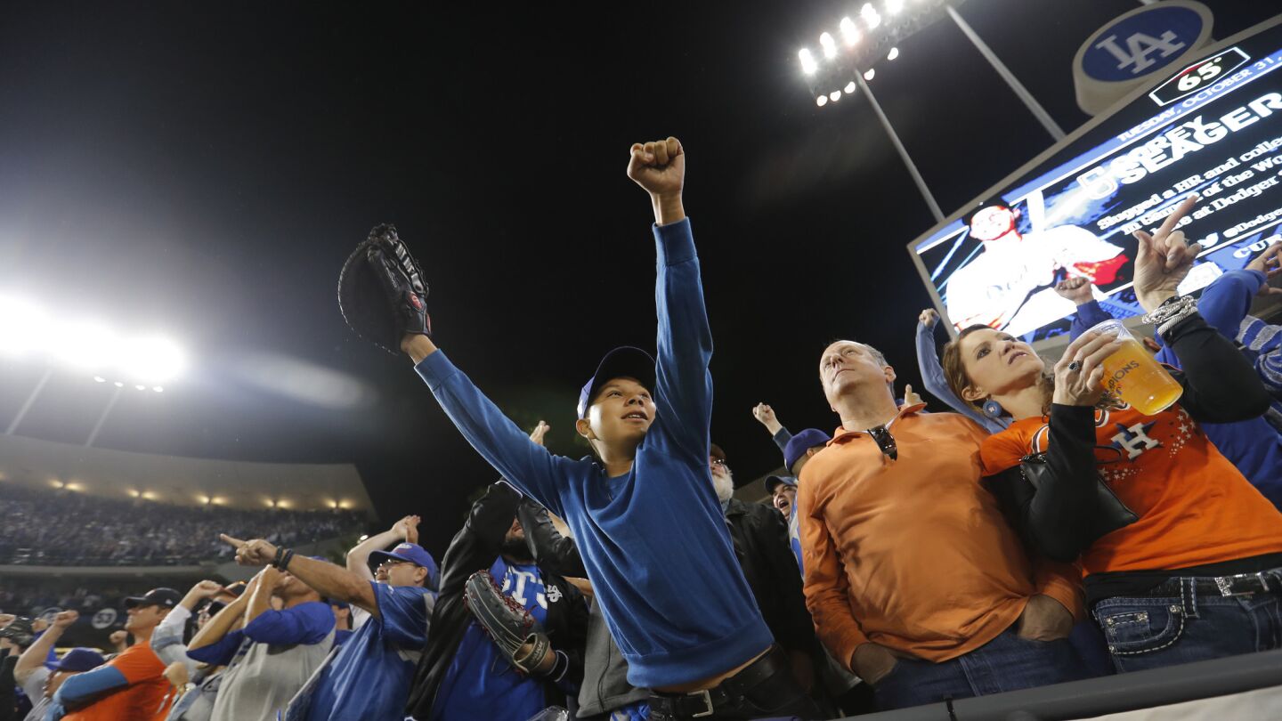 Fans cheer as the Dodgers pull ahead of the Astros in the sixth inning.