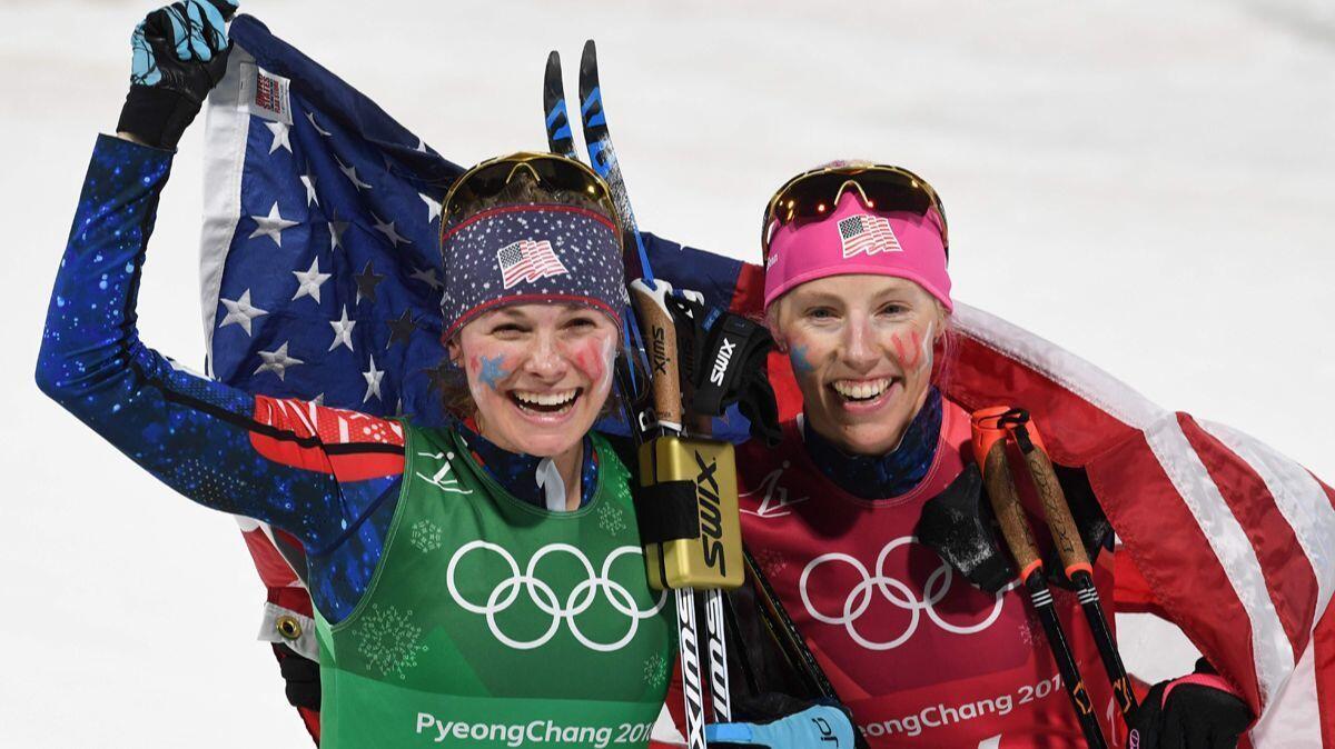 Jessica Diggins, left, and Kikkan Randall celebrate winning gold in the women's cross country team sprint free final during the Pyeongchang 2018 Winter Olympic Games on Wednesday.