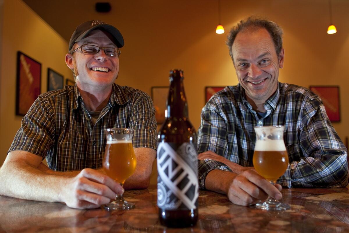 Jeremy Raub, co-owner of Eagle Rock Brewery, left, and Mark Jilg of Craft Brewery in Pasadena have created a beer called Unity for L.A. Beer Week.