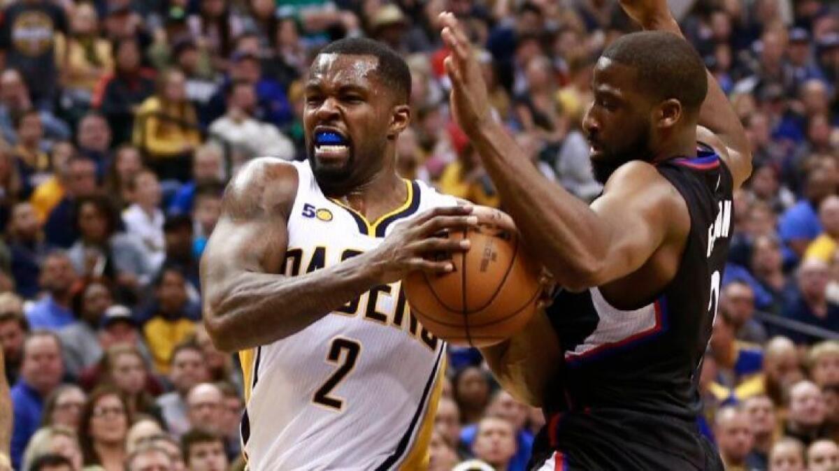 Indiana's Rodney Stuckey (2) drives past Clippers guard Raymond Felton in the second half of a Pacers win on Sunday.