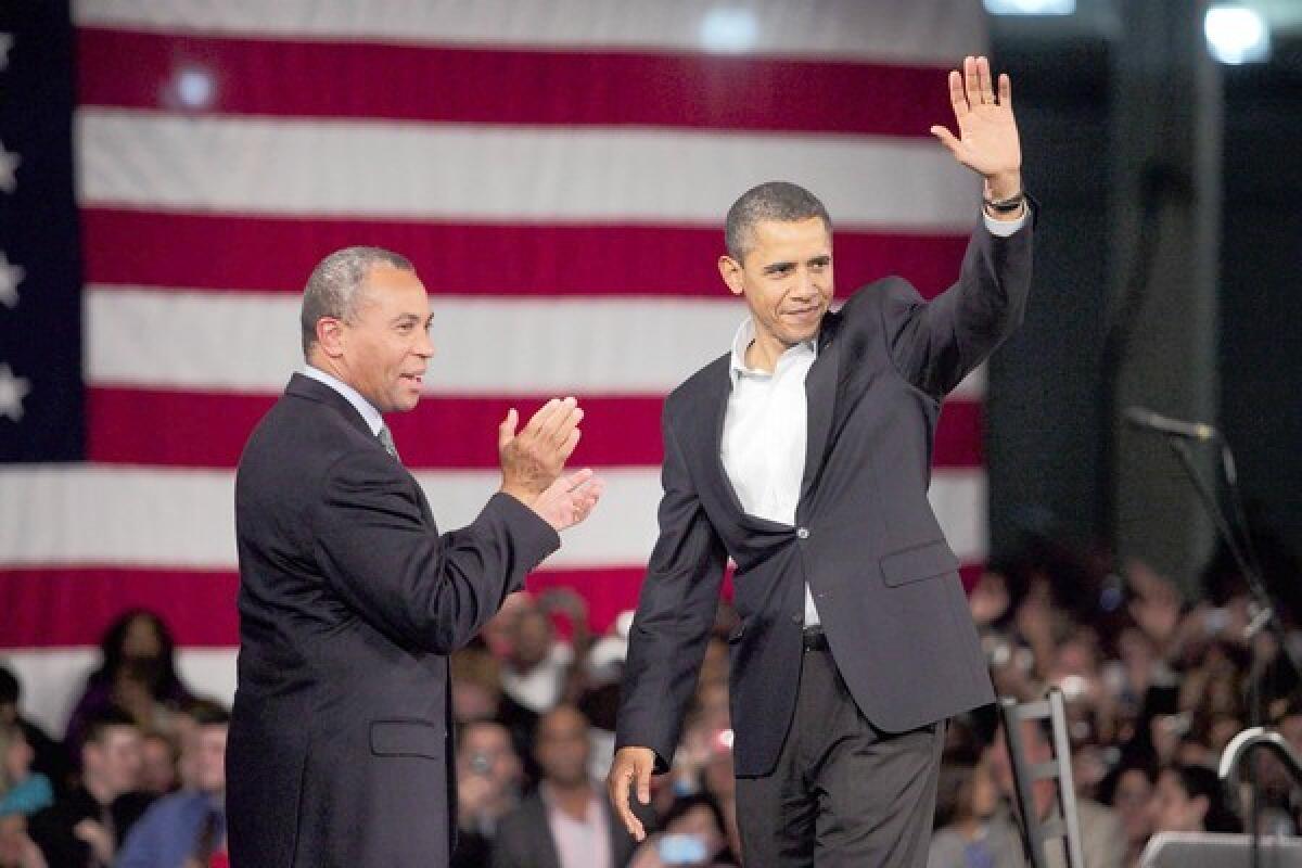 President Barack Obama and Massachusetts governor Deval Patrick, left, wave to the audience after Obama spoke on behalf of Patrick's re-election campaign at the Hynes Convention Center in Boston.
