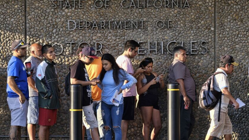 People line up at the Van Nuys DMV in August 2018. A new audit says the DMV didn't properly prepare for the transition to Real ID.