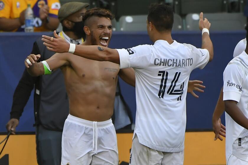 CARSON, CA - MAY 08: Jonathan dos Santos #8 is shirtless as Javier Hernandez #14 of Los Angeles Galaxy congratulates him on his goal against the Los Angeles FC in the second half at Dignity Health Sports Park on May 8, 2021 in Carson, California. The Galaxy won 2-1. (Photo by John McCoy/Getty Images)