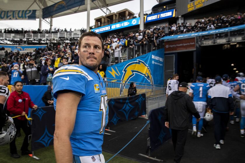 CARSON, CALIF. -- SUNDAY, DECEMBER 22, 2019: Los Angeles Chargers Los Angeles Chargers quarterback Philip Rivers (17) looks back on the field for he last time after game at Dignity Health Sports Park in Carson, Calif., on Dec. 22, 2019. (Brian van der Brug / Los Angeles Times)