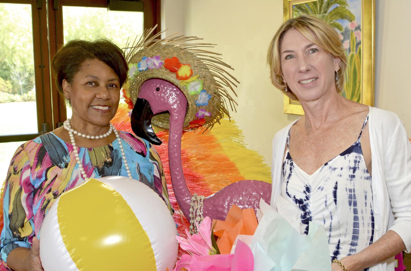 Guild President Glenda Jones, left, and chairwoman Jill Kessler, welcomed members and guests to last week's 'La Prov Beach Babes Summer Bash.'