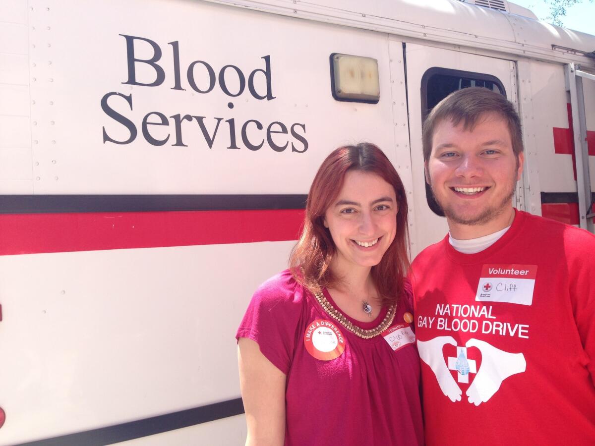 Michelle Carter, 25, of Sherman Oaks, left, with Cliff Biddle, 21, of North Hollywood, after Carter gave blood on behalf of Biddle, who is bisexual.
