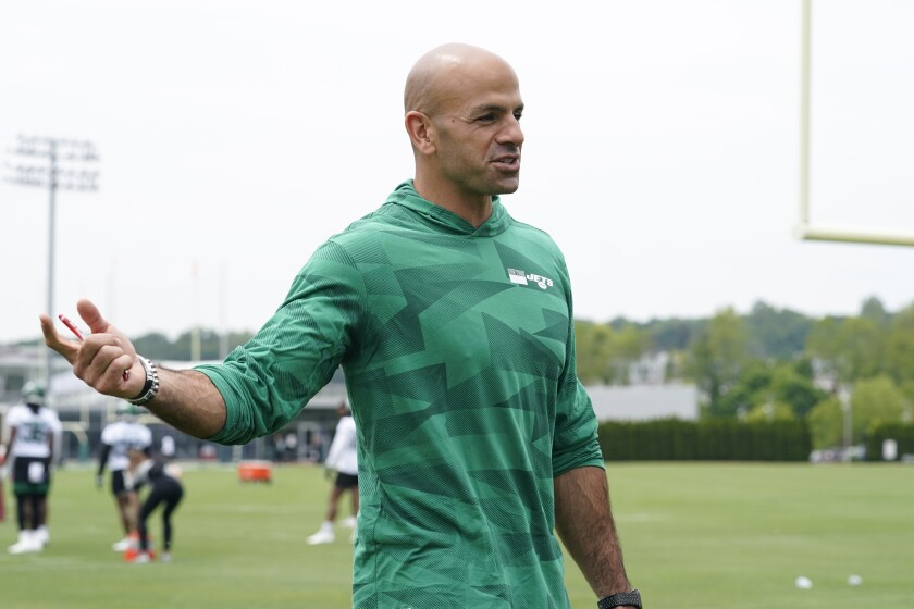 New York Jets head coach Robert Saleh gestures as he speaks informally to a group of journalists in the end zone during an NFL football practice, Wednesday, June 2, 2021, in Florham Park, N.J. (AP Photo/Kathy Willens)