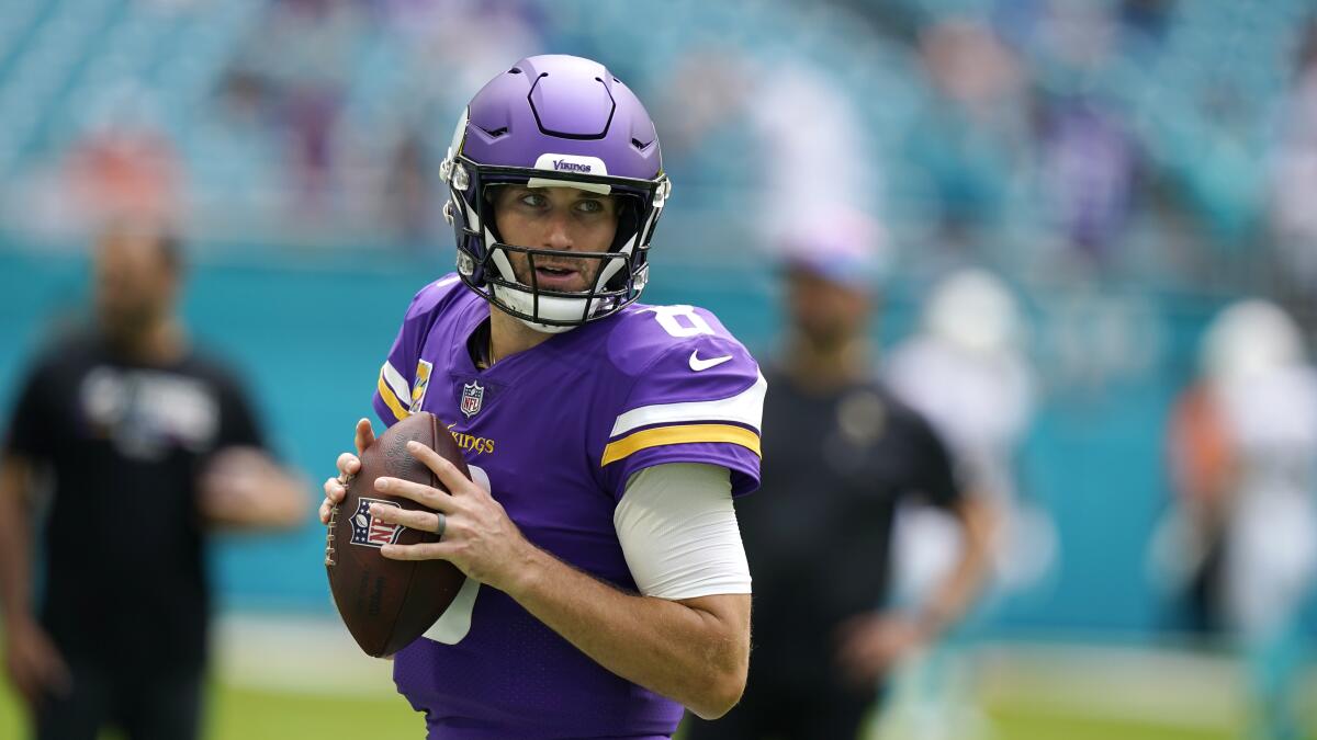 Minnesota Vikings quarterback Kirk Cousins warms up before a game against the Miami Dolphins.