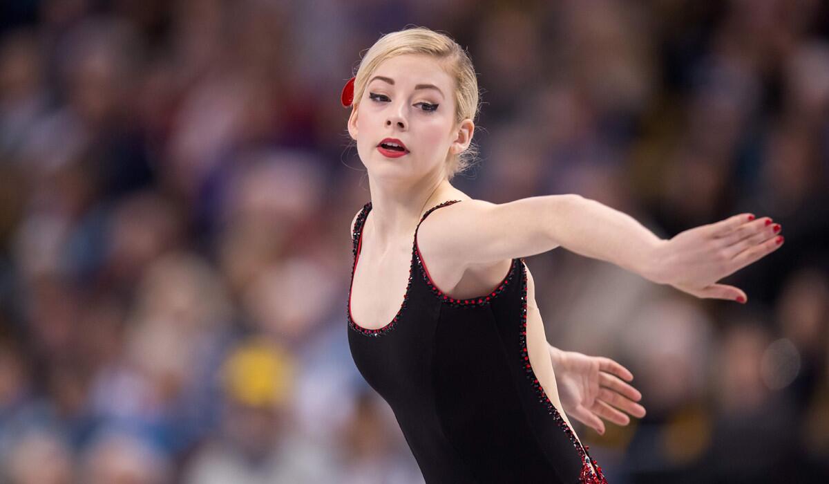 American Gracie Gold was in first place after the women's short program at the figure skating world championships in Boston on Thursday.
