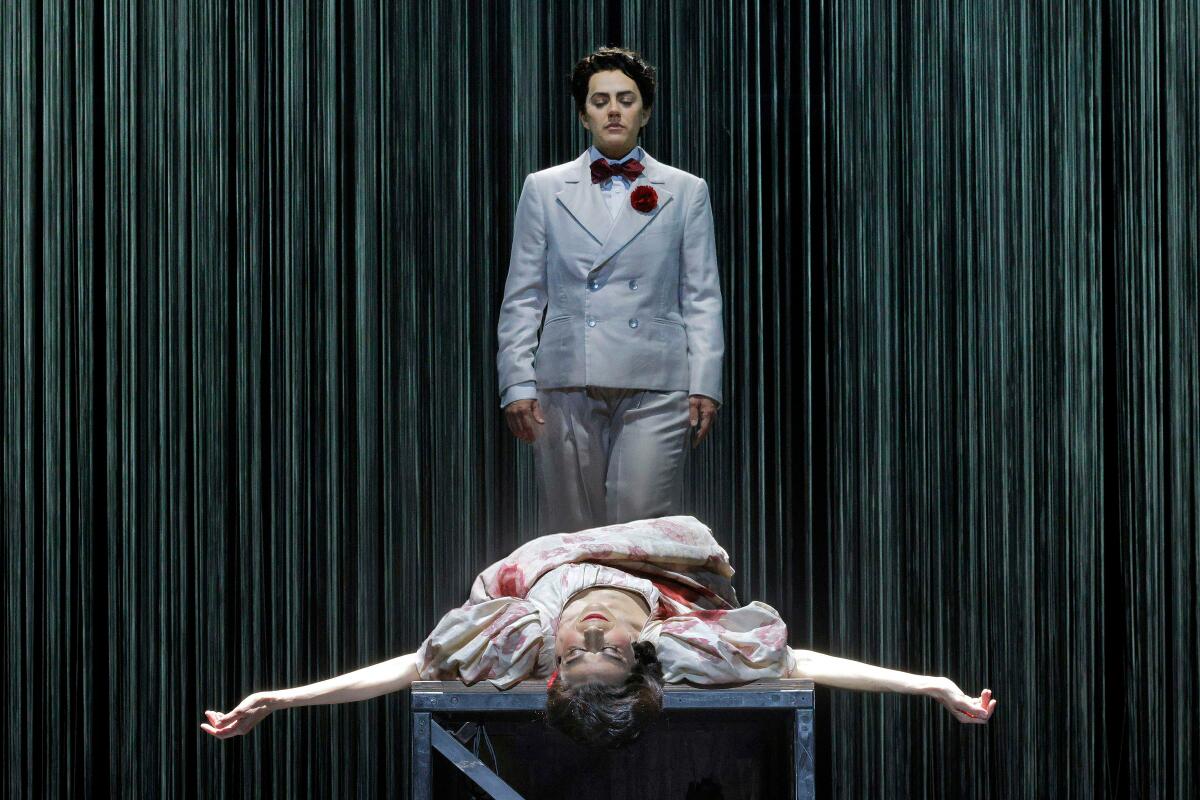 The character of Frederico Garcia Lorca stands over the splayed bidy of Margarita Xirgu in "Ainadamar."