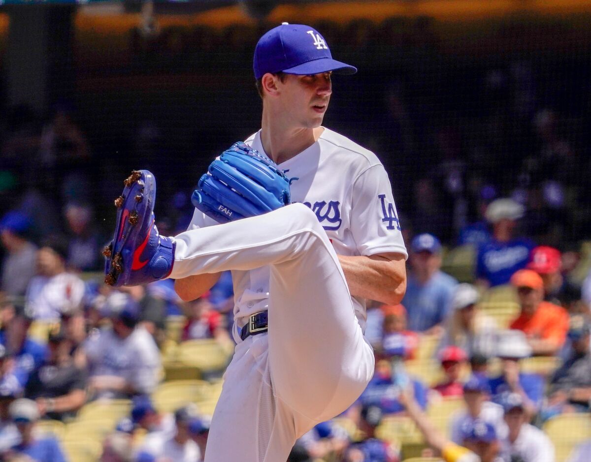 Los Angeles Dodgers starting pitcher Walker Buehler throws to the plate during the second inning.