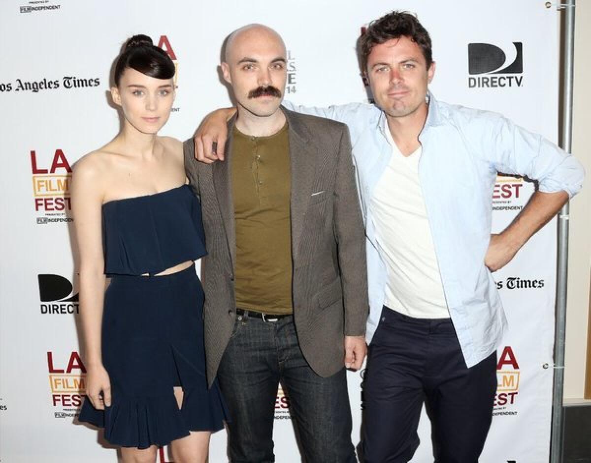 Actress Rooney Mara, writer-director David Lowery, center, and actor Casey Affleck attend a screening of "Ain't Them Bodies Saints" at the Los Angeles Film Festival.