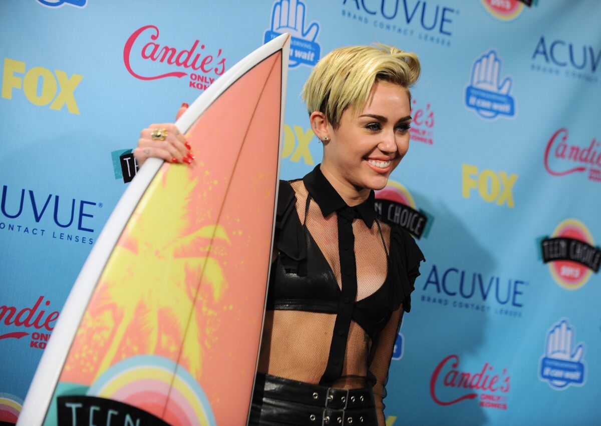 Miley Cyrus was a multiple-award winner: choice TV female scene stealer for "Two and a Half Men", Candies' choice style icon and choice summer song for "We Can't Stop."