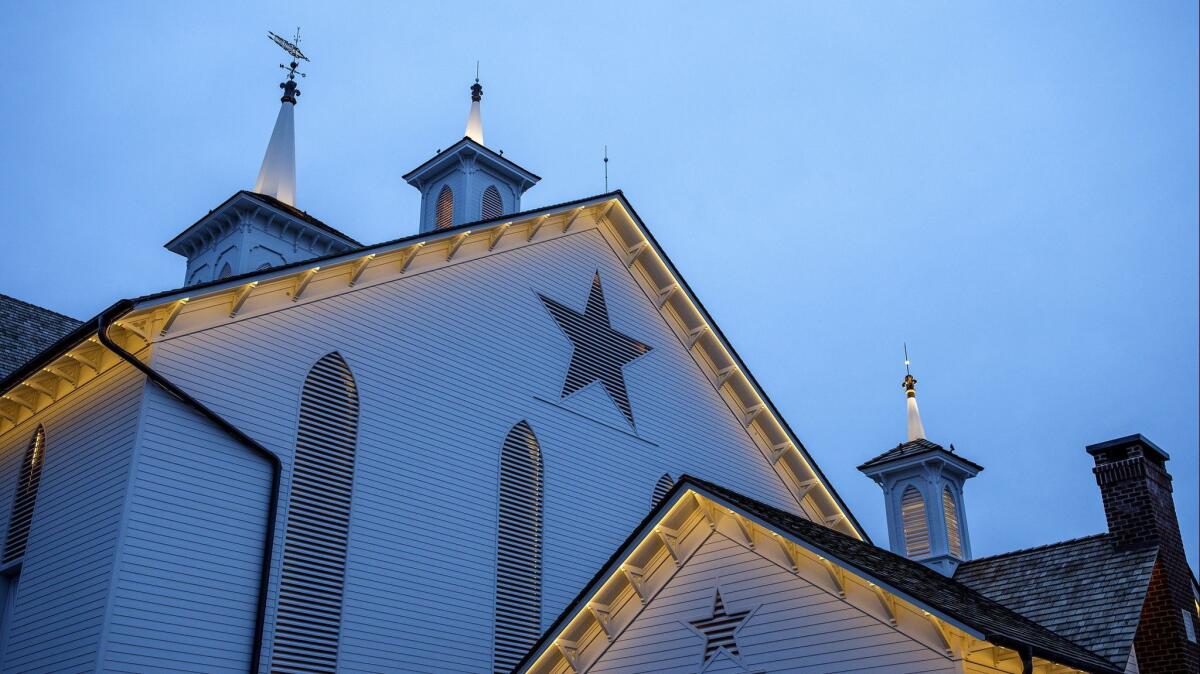 Lights illuminate the exterior of a building at the Star Barn Village in Elizabethtown, Pa. on Dec. 12.