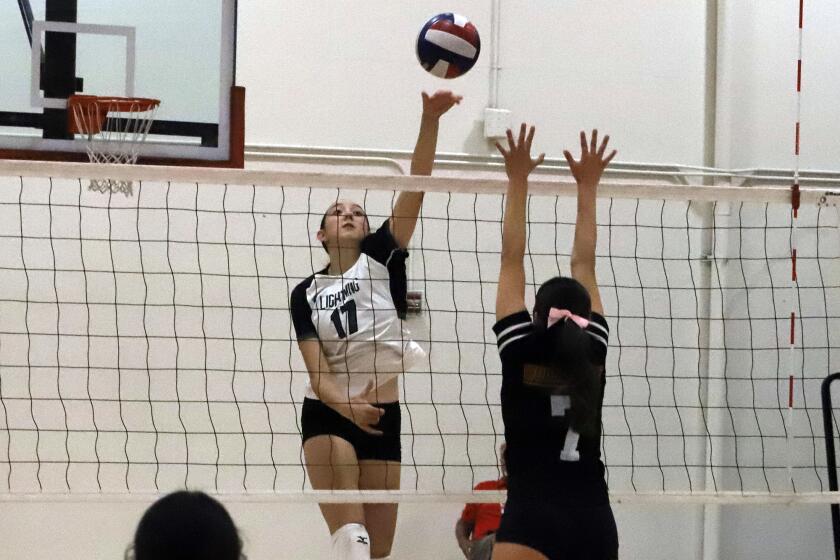 Sage Hill's Addison Uphoff (17) taps the ball over the net during Sage Hill High School girls' volleyball team against Woodbridge High School girls' volleyball team in a volleyball match at Woodbridge High School in Irvine on Thursday, October 3, 2024. (Photo by James Carbone)