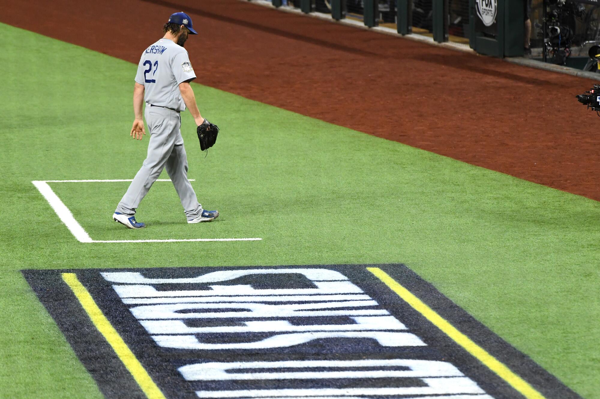 Clayton Kershaw walks to the dugout after pitching 5 2/3 innings for the Dodgers.
