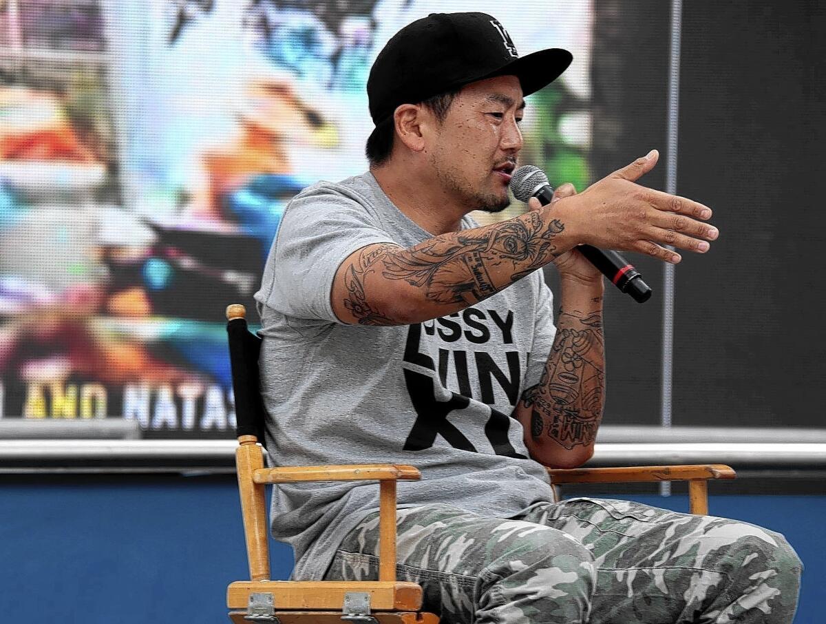 Roy Choi, of Kogi truck fame, talks to the crowd at the L.A. Times Festival of Books. Choi has always insisted he is a cook for the people and that his trucks offer up his ode to Los Angeles.