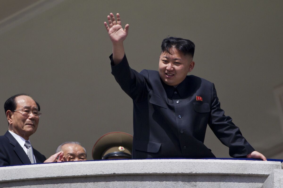 FILE - In this April 15, 2012, file photo, North Korean leader Kim Jong Un waves from a balcony at the end of a military parade at Kim Il Sung Square in Pyongyang, North Korea. Since taking power after his father's death in 2011, Kim has spent 10 years erasing doubts that he was too young and weak to extend his family’s brutal dynastic grip over the impoverished, nuclear-armed state. (AP Photo/David Guttenfelder, File)