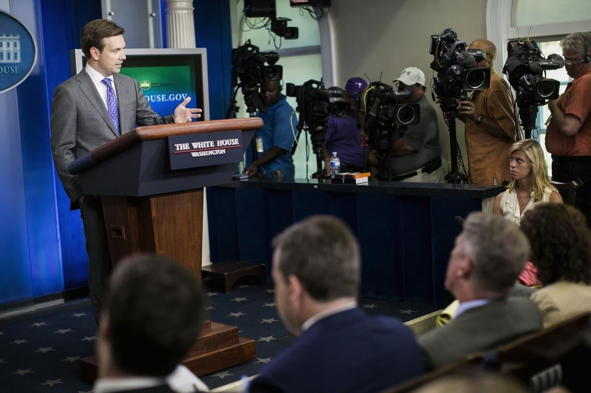 White House spokesman Josh Earnest addresses journalists at a daily briefing, during which he avoided discussion of whether the Obama administration's "red line" had been crossed in Syria.