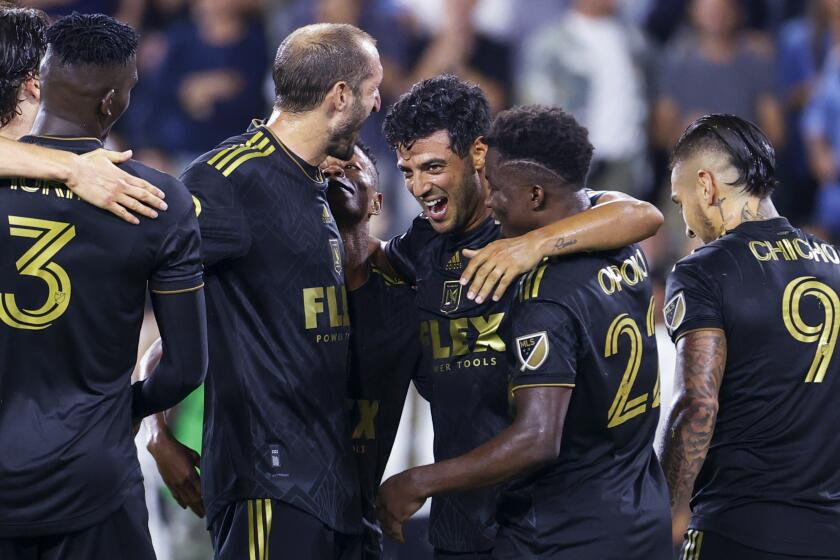 Los Angeles FC forward Carlos Vela, third from right, celebrates his goal with teammates.