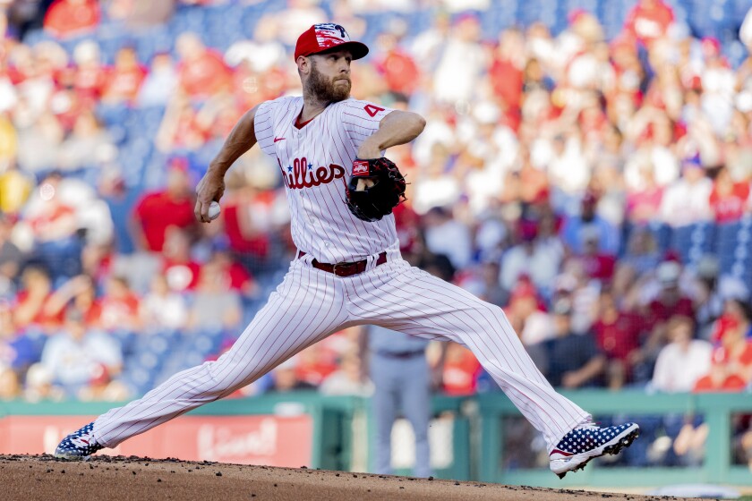 Philadelphia Phillies starting pitcher Zack Wheeler throws during the first inning of a baseball game against the St. Louis Cardinals, Sunday, July 3, 2022, in Philadelphia. (AP Photo/Laurence Kesterson)