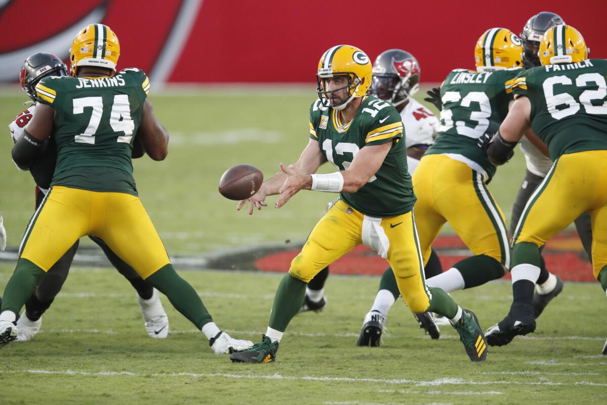 Green Bay Packers quarterback Aaron Rodgers tosses the ball.