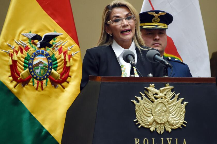 Bolivia's interim president Jeanine Anez skpeaks after signing off on new elections excluding ex-president Evo Morales, in a key step towards ending weeks of unrest as the caretaker government prepared to meet with protesters to end weeks of unrest, in La Paz on November 24, 2019. - At least 32 people have been killed in violence that erupted after a disputed election on October 20, with blockades causing severe fuel and food shortages in La Paz and other cities. (Photo by AIZAR RALDES / AFP) (Photo by AIZAR RALDES/AFP via Getty Images)