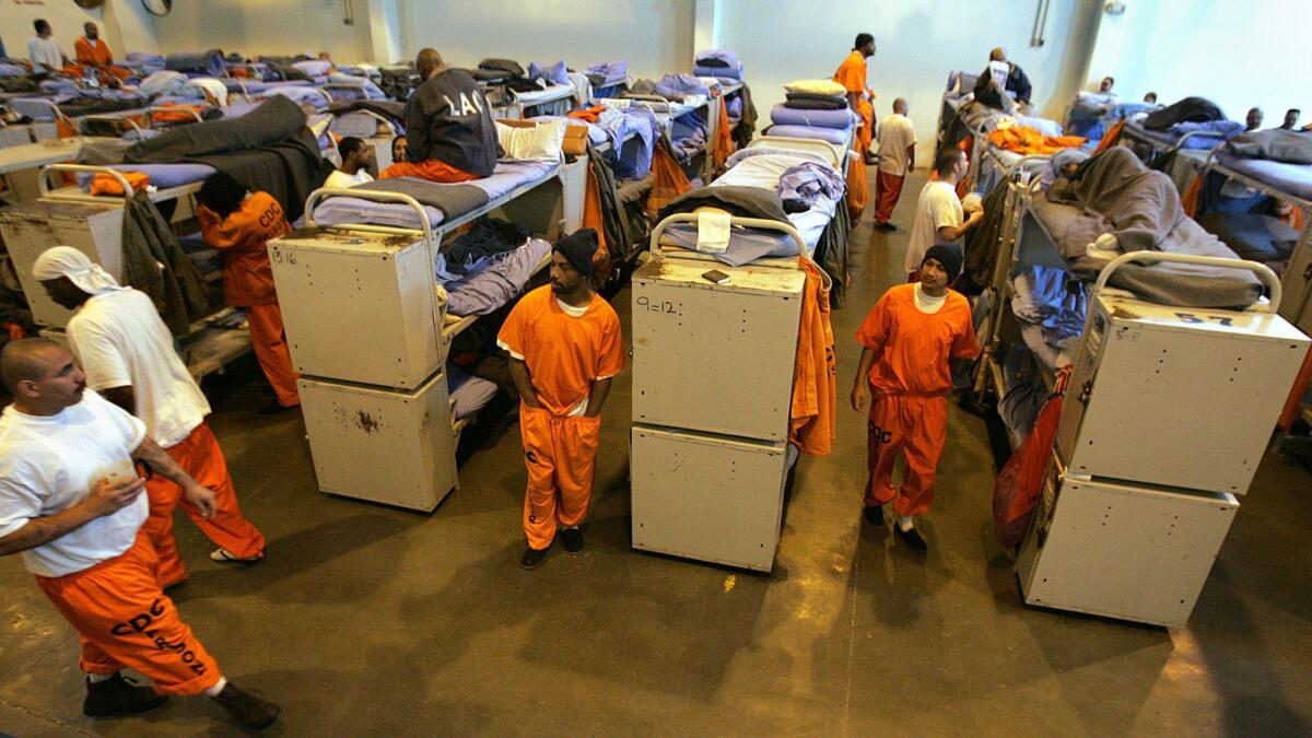 In a photograph from 2007, inmate beds fill a gymnasium converted into a temporary "emergency" sleeping area at California State Prison, Los Angeles County in Lancaster. This kind of state prison overcrowding is now a thing of the past.