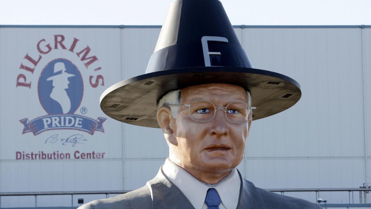 A statue of Pilgrim's Pride founder Lonnie "Bo" Pilgrim is displayed outside the company's distribution center in Pittsburg, Texas.