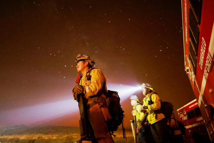 Cal Fire firefighters from Camarillo gets ready to work as the Lake Fire burns in Los Olivos, on July 9, 2024. (Photo by DAVID SWANSON / AFP) (Photo by DAVID SWANSON/AFP via Getty Images)