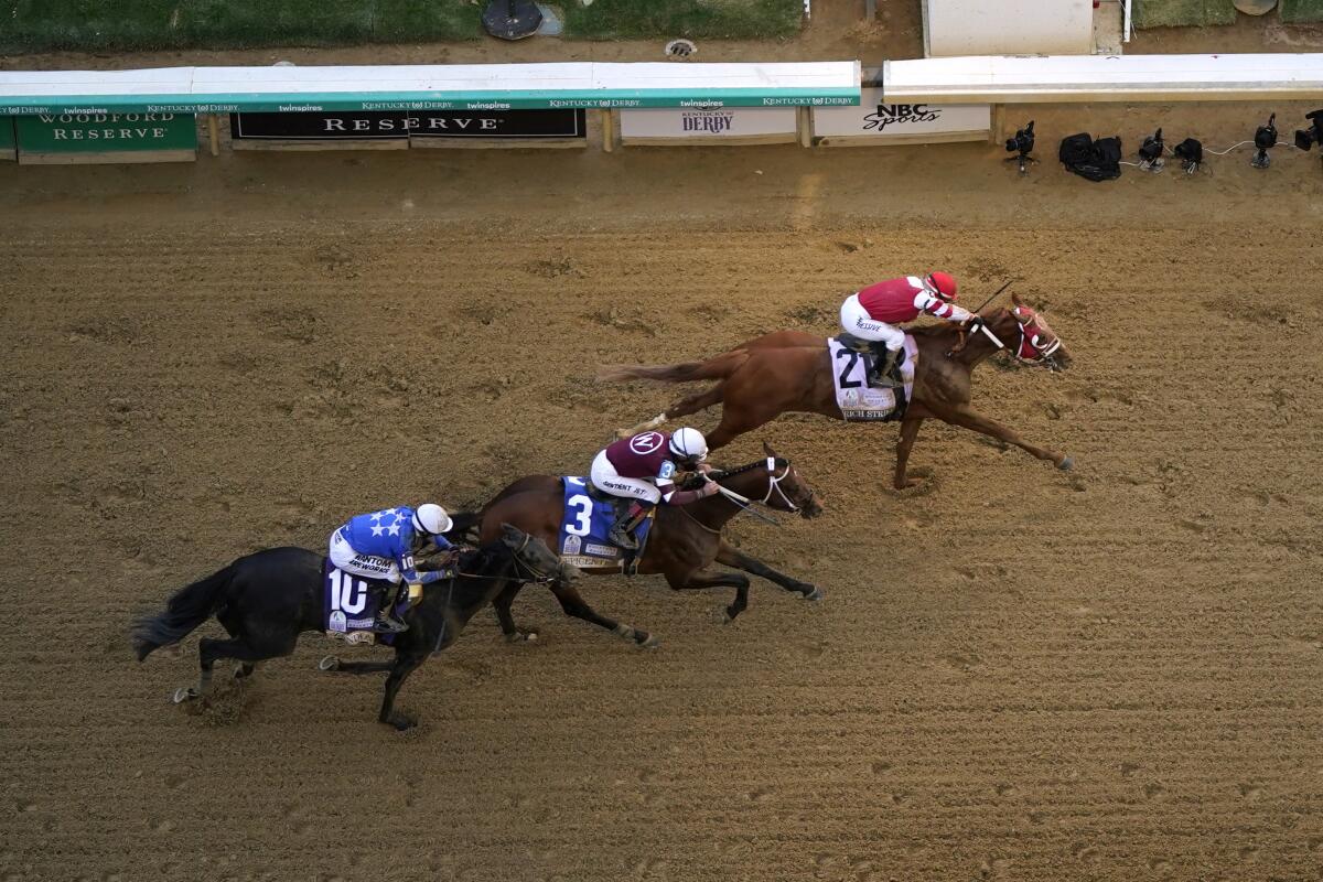 Rich Strike (21) beats Epicenter (3) and Zandon (10) to win the Kentucky Derby on Saturday.