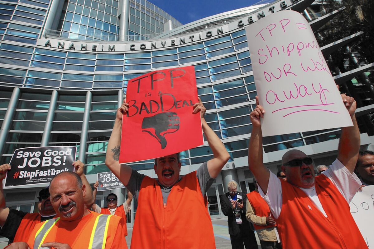 Members of the United Brotherhood of Carpenters and Joiners rally against the Trans-Pacific Partnership outside the California Democratic Party Convention in Anaheim.