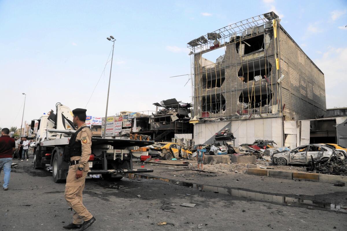 The site of one of several car bombings that struck Baghdad on Oct. 16. As international airstrikes target Islamic State elsewhere, the militants have stepped up terrorist attacks in the Iraqi capital.