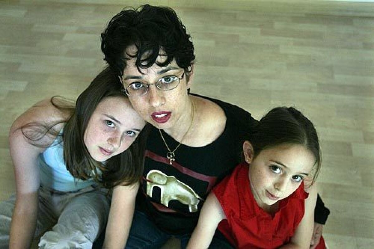 DEVASTATED: Patty OReilly, whose husband was killed by a drunk driver, with daughters Erin, left, and Siobhan, right.