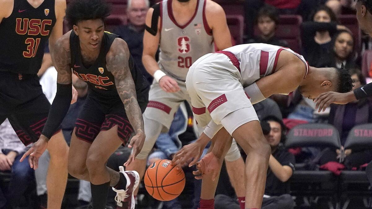 USC guard Kevin Porter Jr. (4) steals the ball from Stanford forward KZ Okpala (0) during the first half on Wednesday.